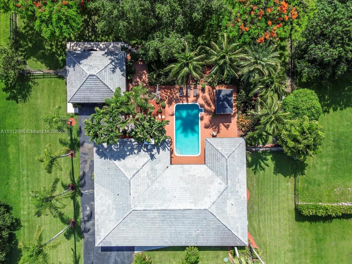 an aerial view of a house with a garden