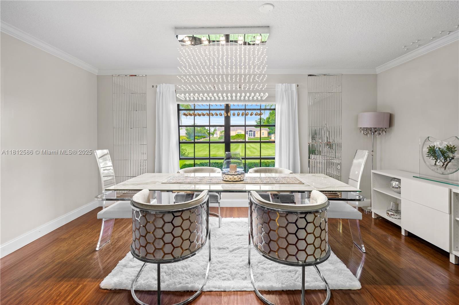 3030 Southwest 117th Avenue Davie, FL 33330 - Photo 14 of 47 a dining room with furniture a rug and wooden floor