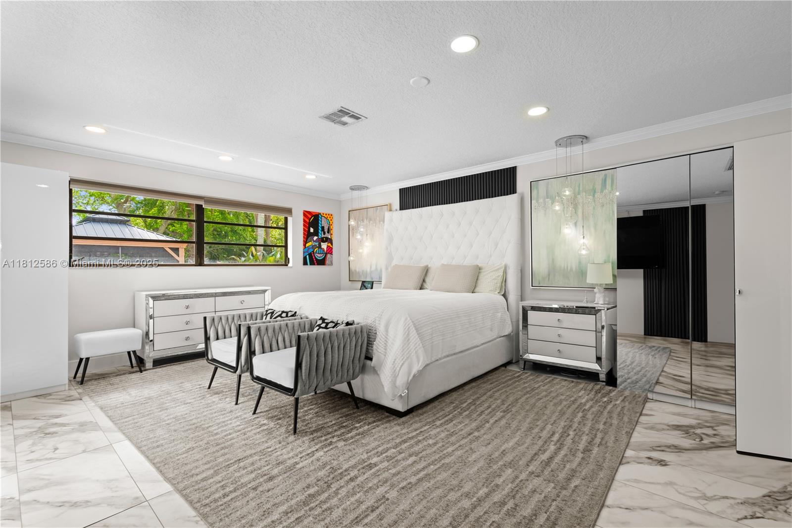 3030 Southwest 117th Avenue Davie, FL 33330 - Photo 15 of 47 a bedroom with a bed and wooden floor