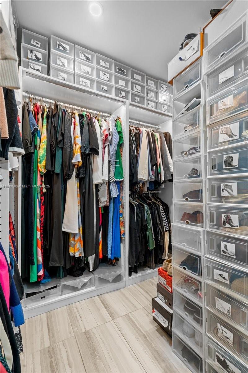 3030 Southwest 117th Avenue Davie, FL 33330 - Photo 19 of 47 a view of walk in closet with clothes and shoes