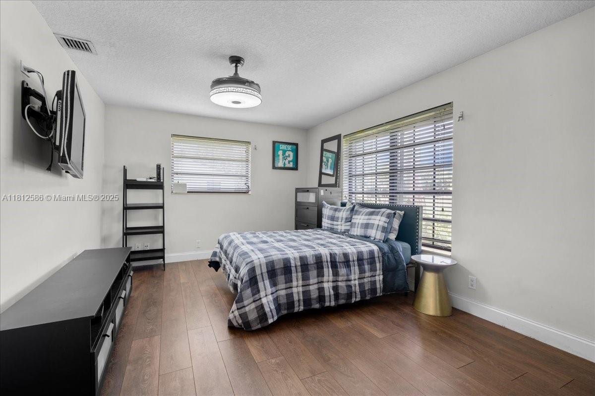 3030 Southwest 117th Avenue Davie, FL 33330 - Photo 20 of 47 a bedroom with a bed and a window