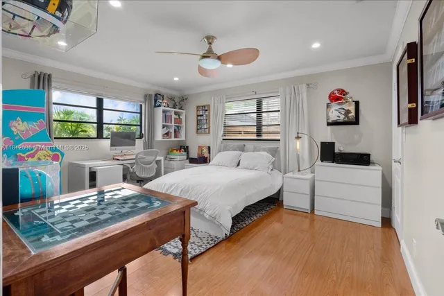 an aerial view of a residential houses with outdoor space and street view
