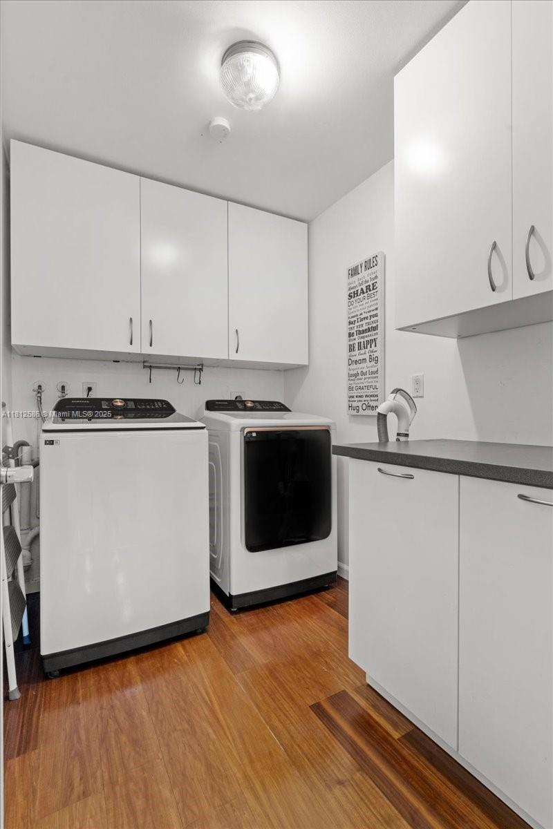 3030 Southwest 117th Avenue Davie, FL 33330 - Photo 25 of 47 a kitchen with wooden cabinets and white appliances