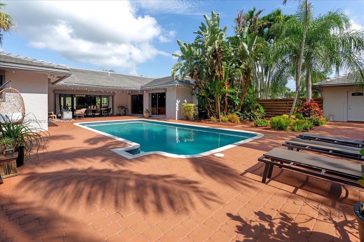 3030 Southwest 117th Avenue Davie, FL 33330 - Photo 26 of 47 a view of a house with swimming pool and sitting area