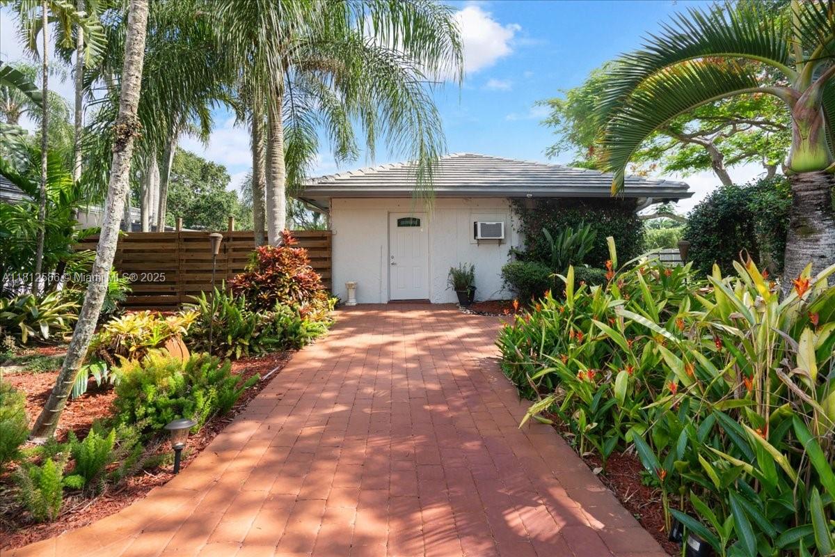 3030 Southwest 117th Avenue Davie, FL 33330 - Photo 34 of 47 a view of a garden with palm trees