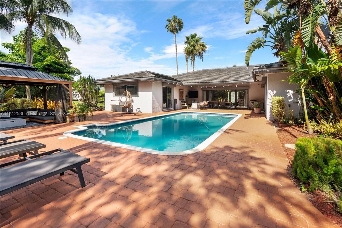 3030 Southwest 117th Avenue Davie, FL 33330 - Photo 5 of 47 a view of a house with swimming pool and sitting area
