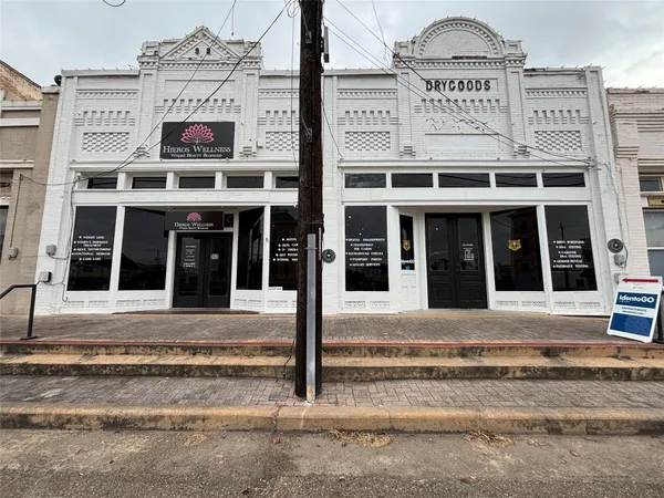 a view of a building with refrigerator and traffic signal