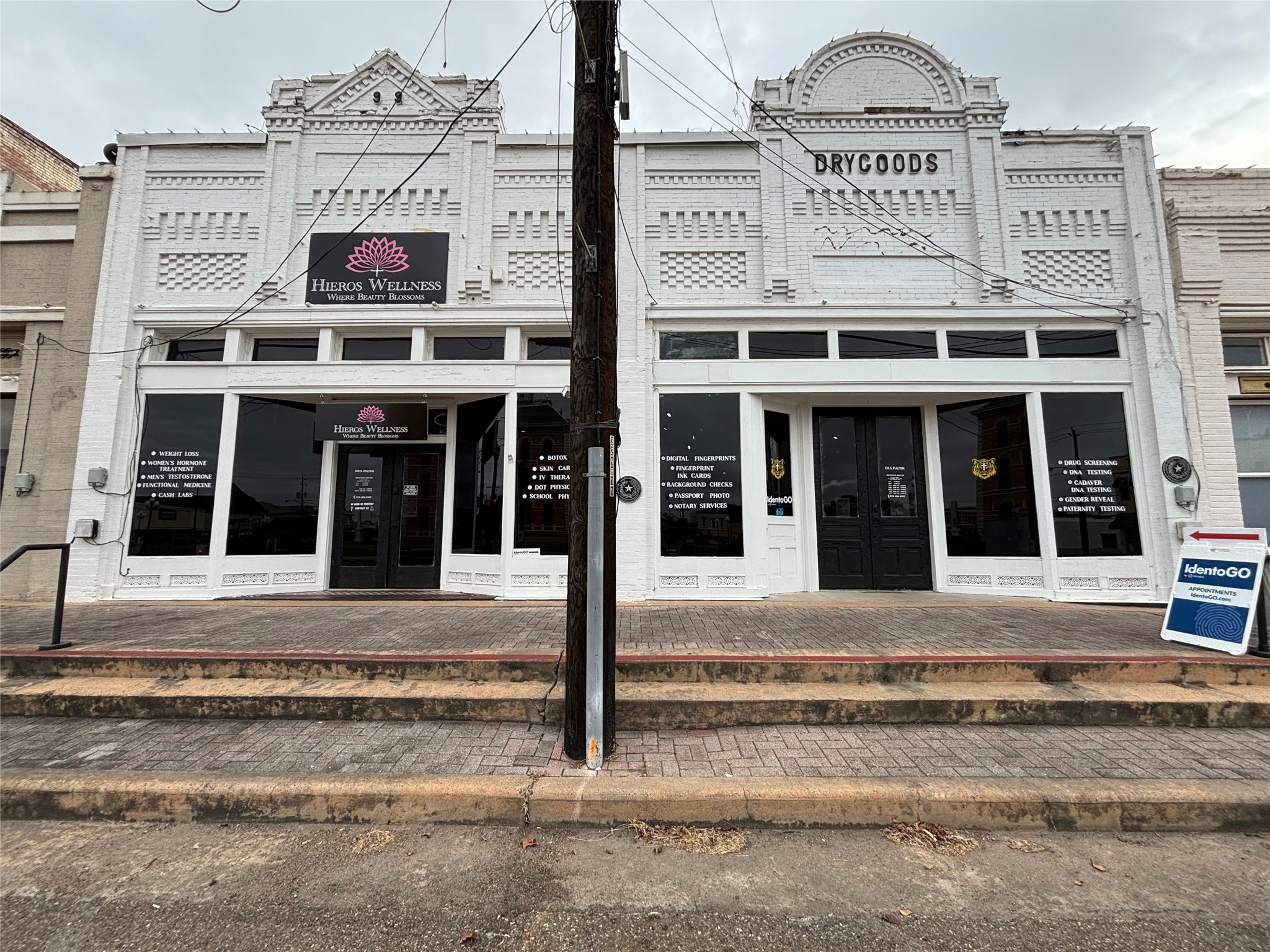 a view of a building with refrigerator and traffic signal