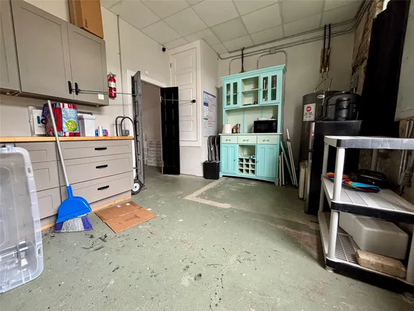 a view of room with window and refrigerator