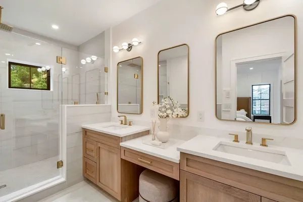 a bathroom with a sink double vanity and a mirror