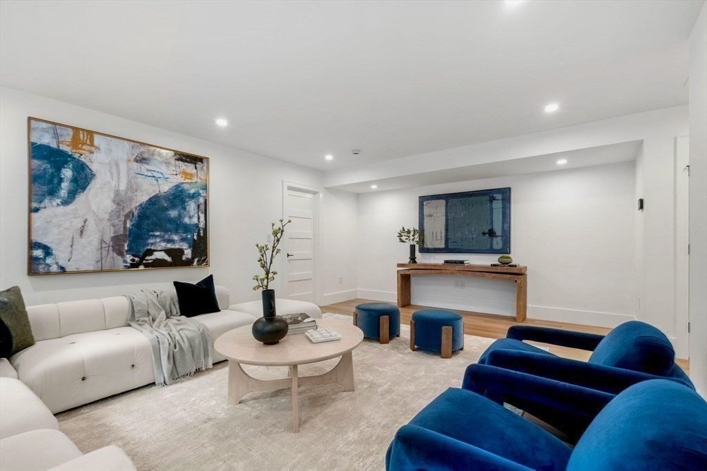 71 Cloverdale Road, Unit 1 Newton, MA 02461 - Photo 14 of 32 a living room with furniture and a flat screen tv