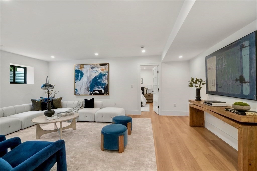 71 Cloverdale Road, Unit 1 Newton, MA 02461 - Photo 15 of 32 a living room with furniture and a wooden floor