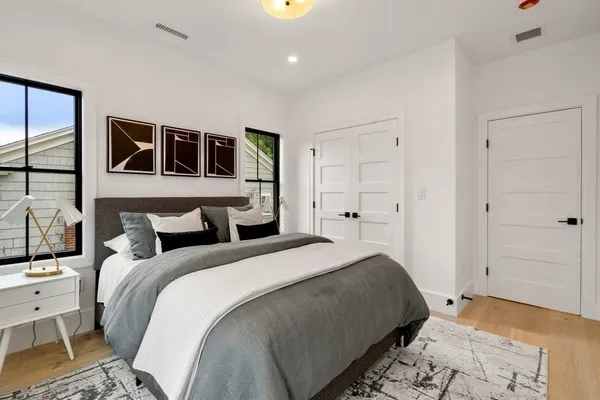 a bed room with a bed and a window