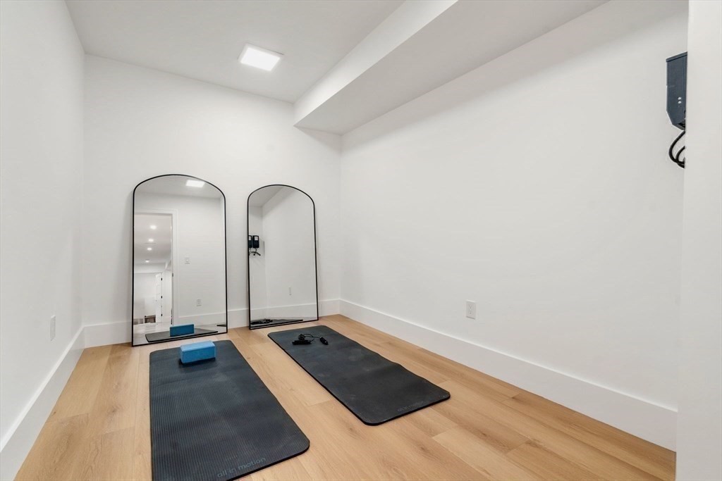 71 Cloverdale Road, Unit 1 Newton, MA 02461 - Photo 23 of 32 a view of a room with wooden floor