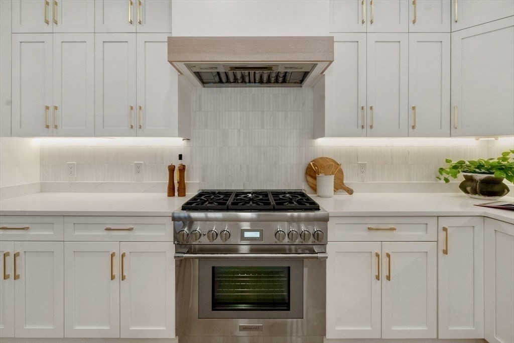 71 Cloverdale Road, Unit 1 Newton, MA 02461 - Photo 3 of 32 a stove top oven sitting inside of a kitchen