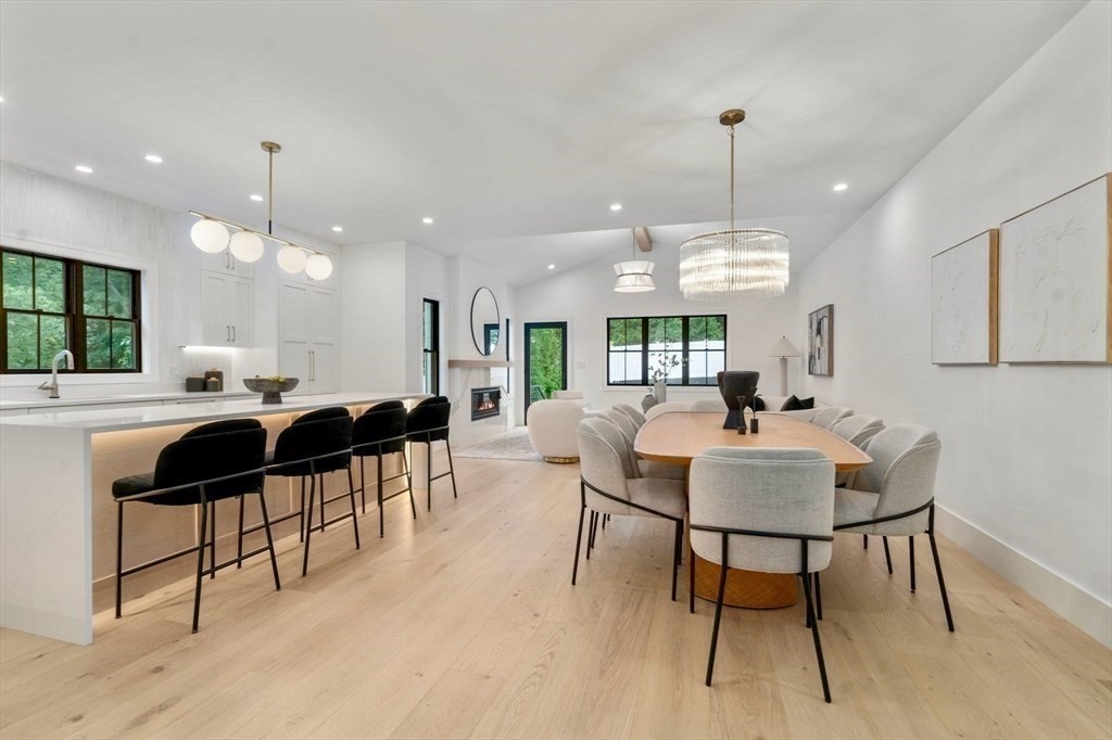 71 Cloverdale Road, Unit 1 Newton, MA 02461 - Photo 31 of 32 a living room with lots of furniture and a view of a chandelier