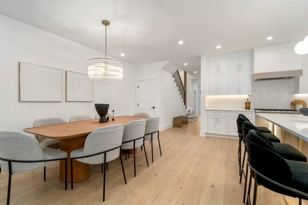 71 Cloverdale Road, Unit 1 Newton, MA 02461 - Photo 6 of 32 a view of a dining room with furniture and wooden floor