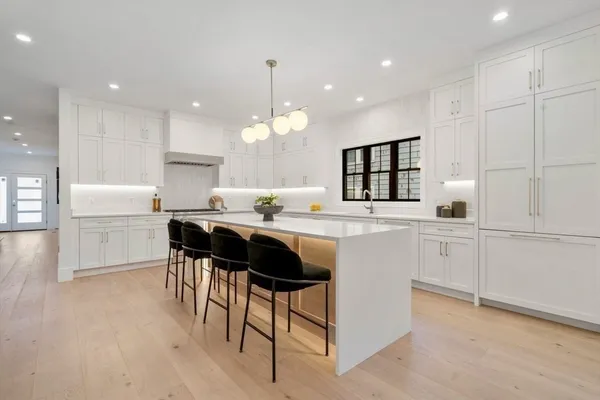 a kitchen with a sink cabinets and window