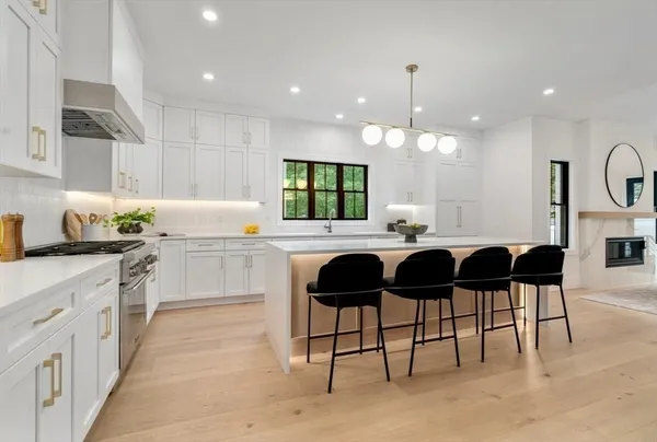 a kitchen with a sink cabinets and window