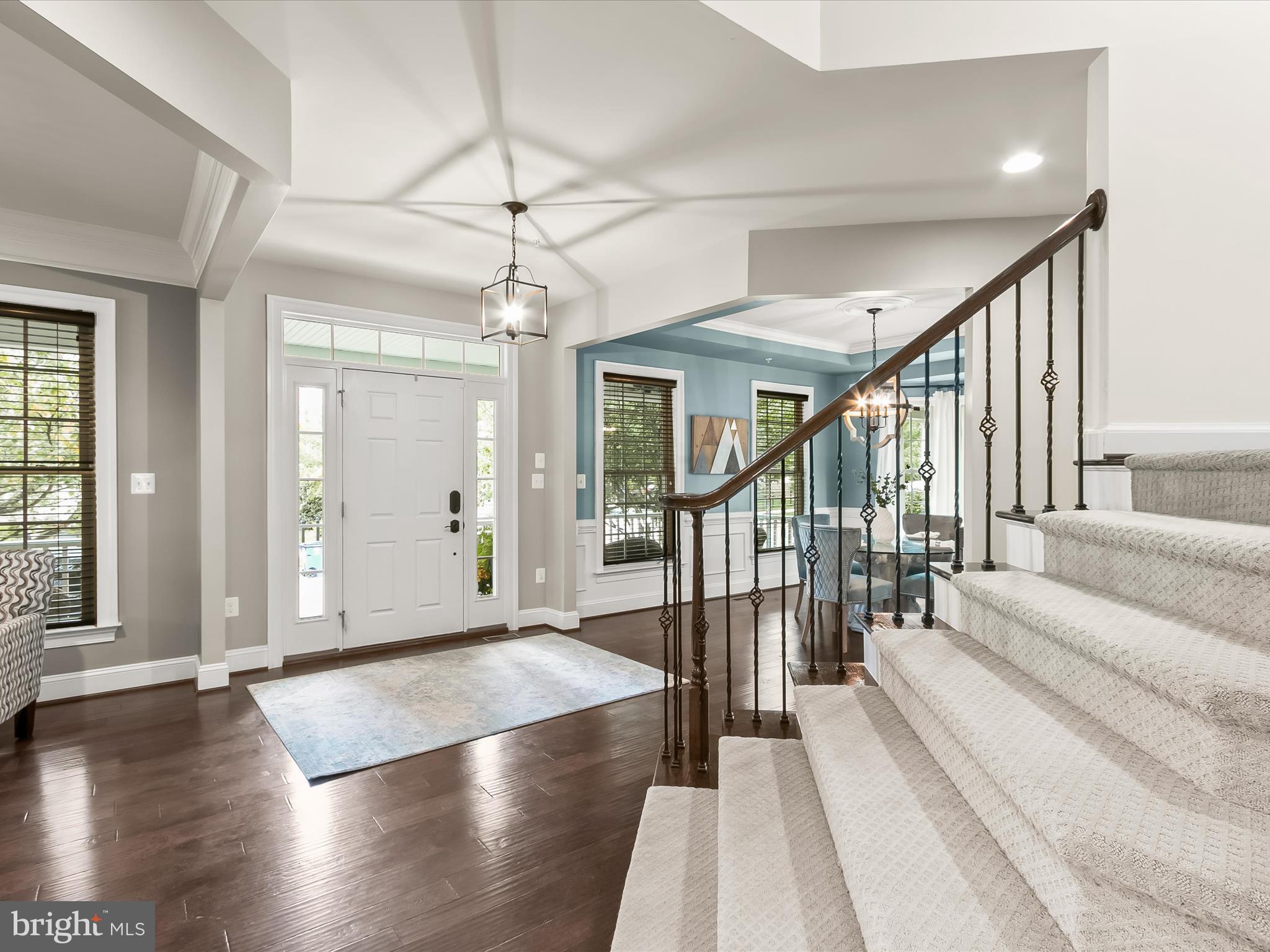 7775 Elmwood Road Fulton, MD 20759 - Photo 6 of 86 a view of a hallway with wooden floor and windows