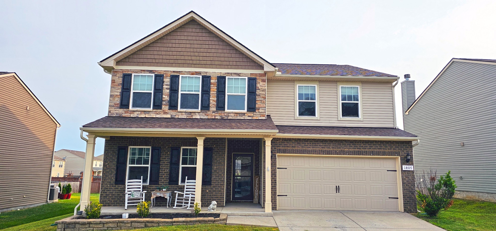 1407 Old Stone Road Lebanon, TN 37087 - Photo 1 of 45 a view of a brick house with large windows and a yard