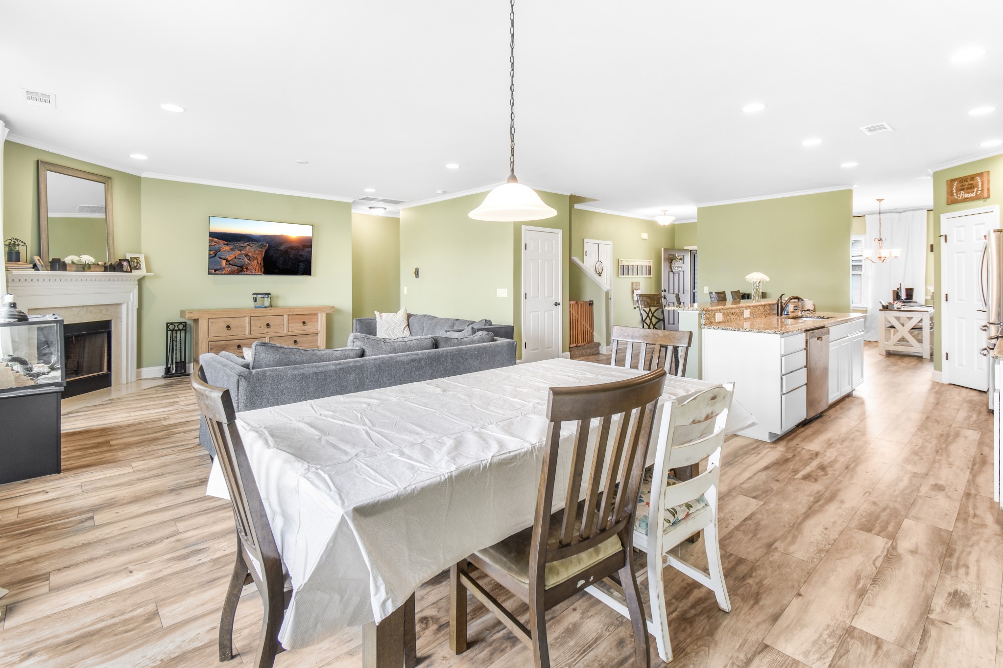 1407 Old Stone Road Lebanon, TN 37087 - Photo 12 of 45 a dining room with a table chairs and a kitchen view