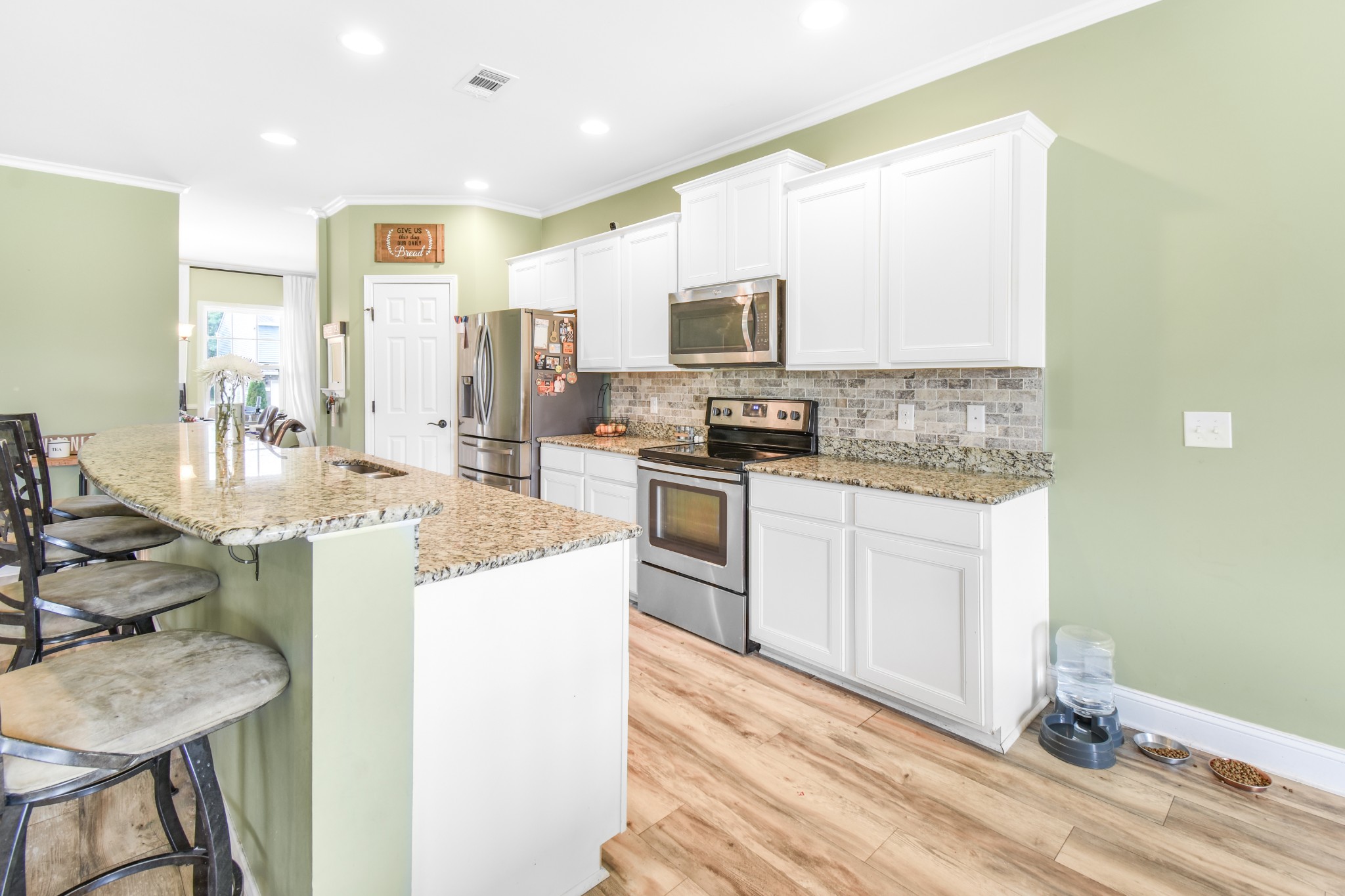 1407 Old Stone Road Lebanon, TN 37087 - Photo 13 of 45 a kitchen with a sink stove and refrigerator
