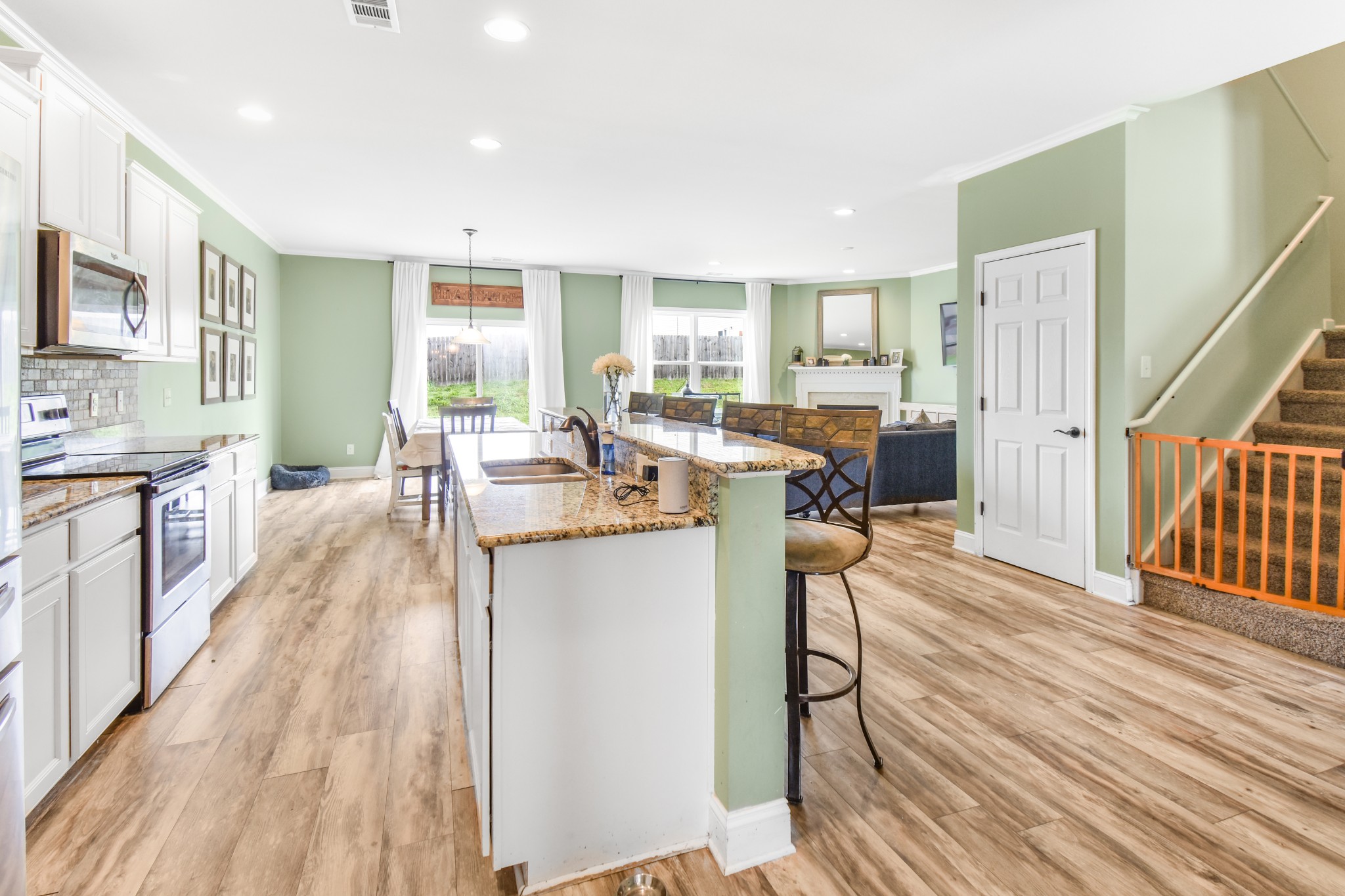 1407 Old Stone Road Lebanon, TN 37087 - Photo 16 of 45 a very nice looking living room with kitchen island furniture and a wooden floor