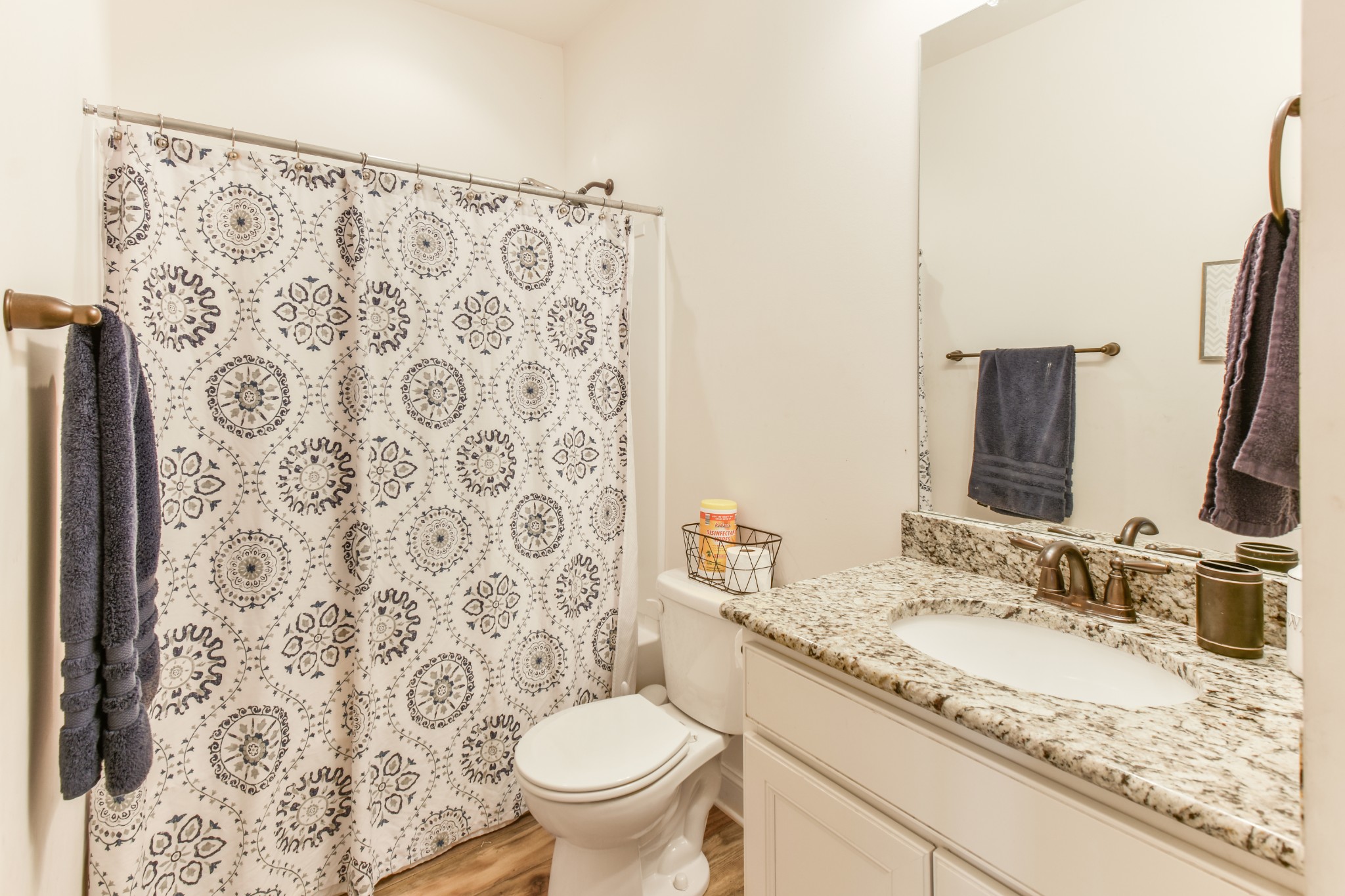 1407 Old Stone Road Lebanon, TN 37087 - Photo 20 of 45 a bathroom with a granite countertop sink toilet and a mirror