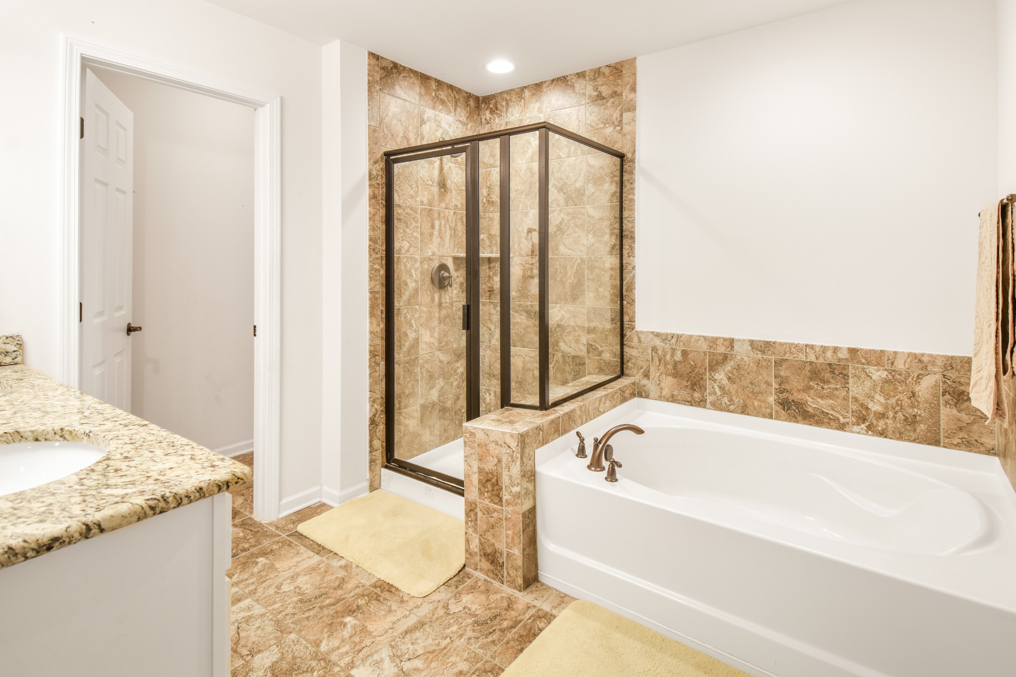 1407 Old Stone Road Lebanon, TN 37087 - Photo 23 of 45 a bathroom with a granite countertop tub and a sink