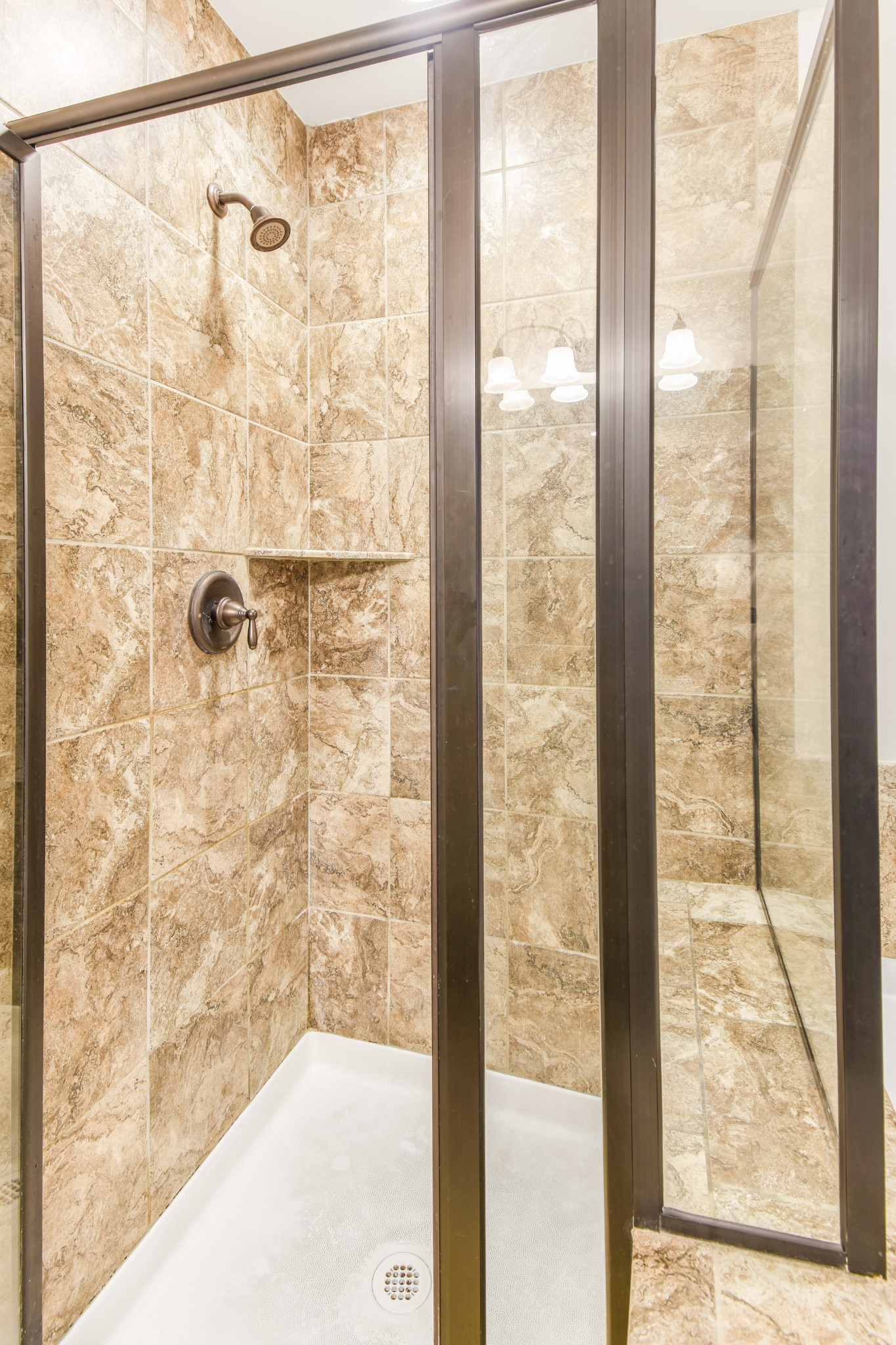 1407 Old Stone Road Lebanon, TN 37087 - Photo 24 of 45 a bathroom with a glass shower door
