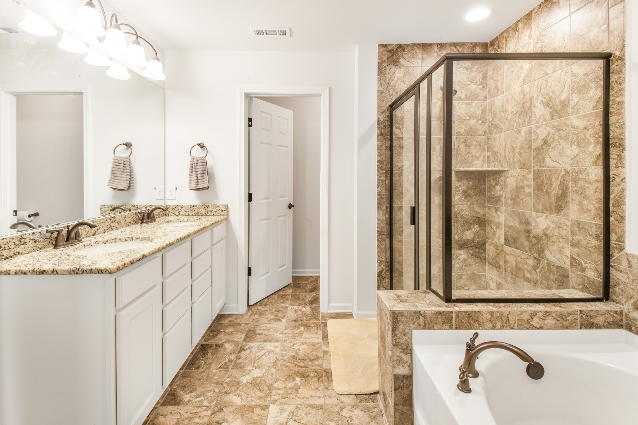 1407 Old Stone Road Lebanon, TN 37087 - Photo 25 of 45 a bathroom with a granite countertop sink a mirror and a shower