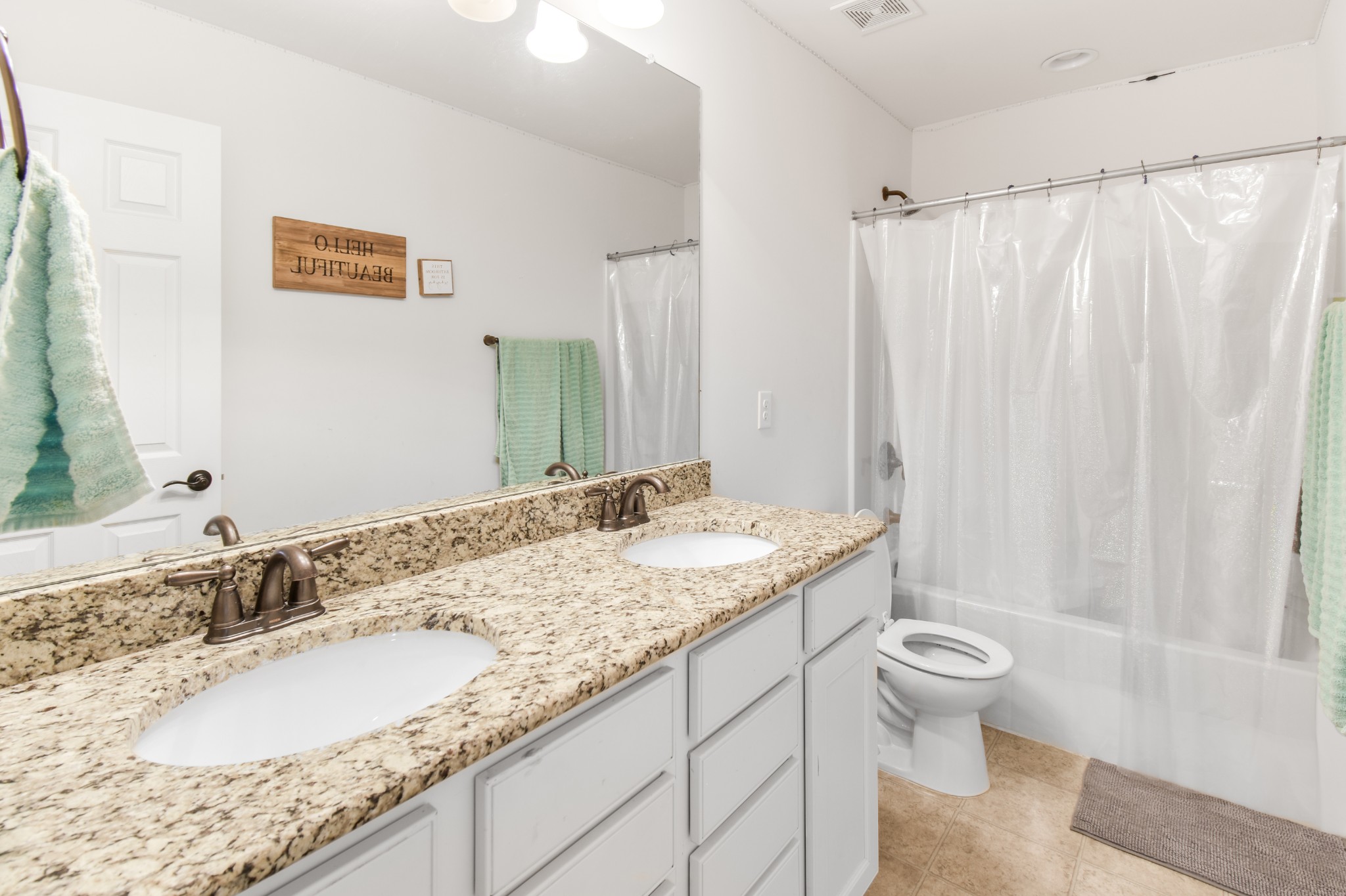 1407 Old Stone Road Lebanon, TN 37087 - Photo 30 of 45 a bathroom with a granite countertop sink and a mirror
