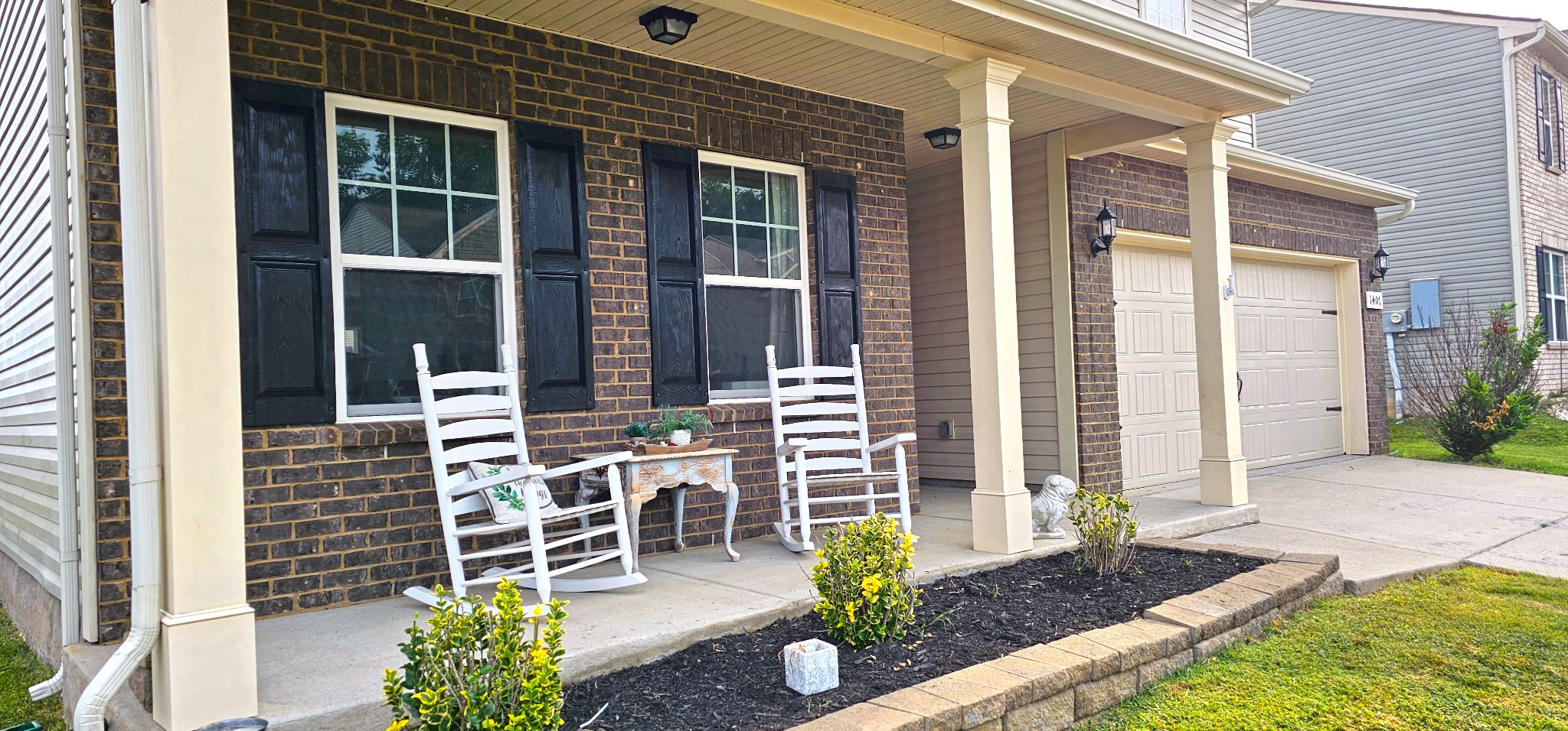 1407 Old Stone Road Lebanon, TN 37087 - Photo 3 of 45 a front view of a house with chairs and table in patio