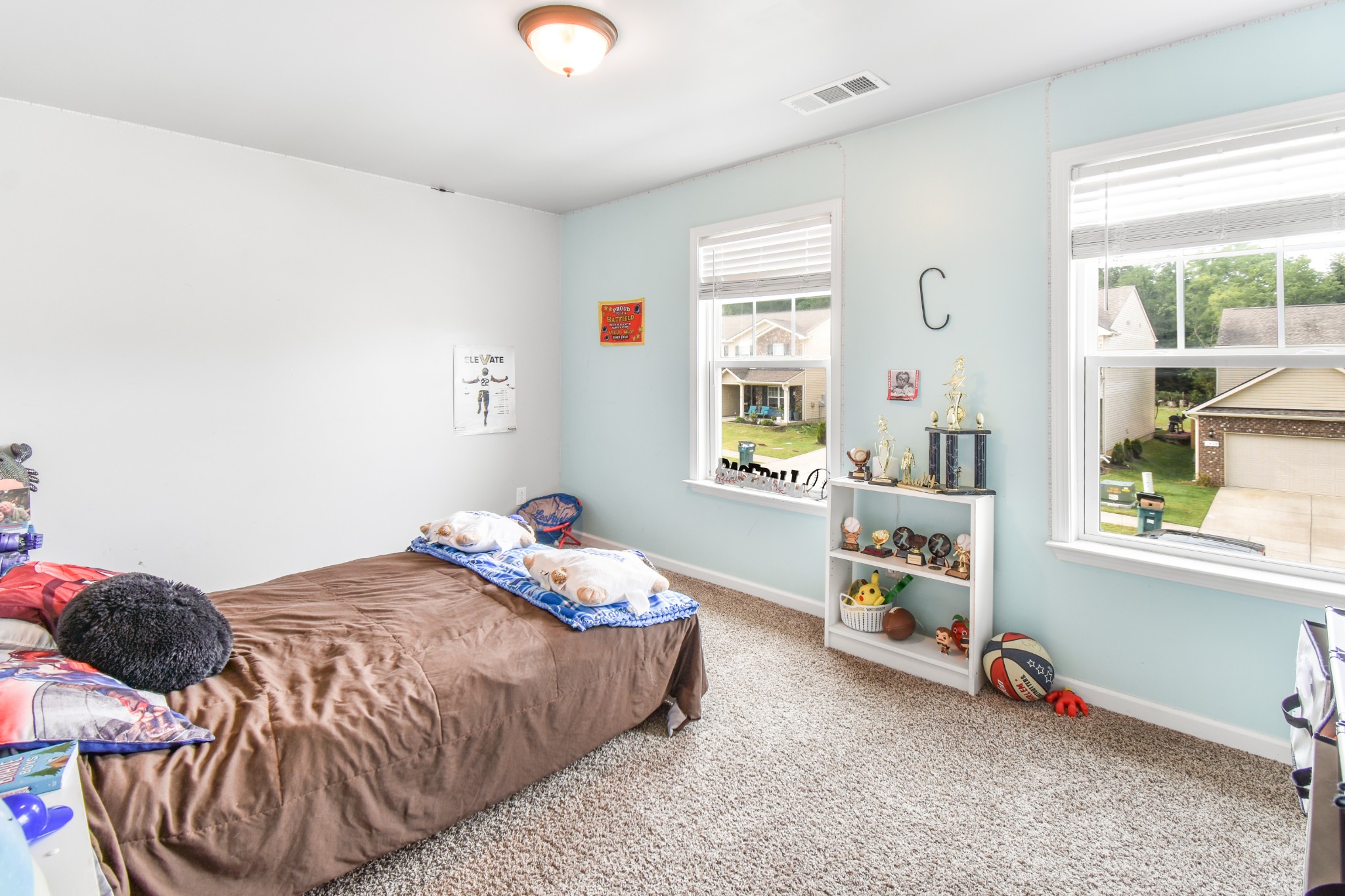 1407 Old Stone Road Lebanon, TN 37087 - Photo 31 of 45 a bedroom with a bed and a window