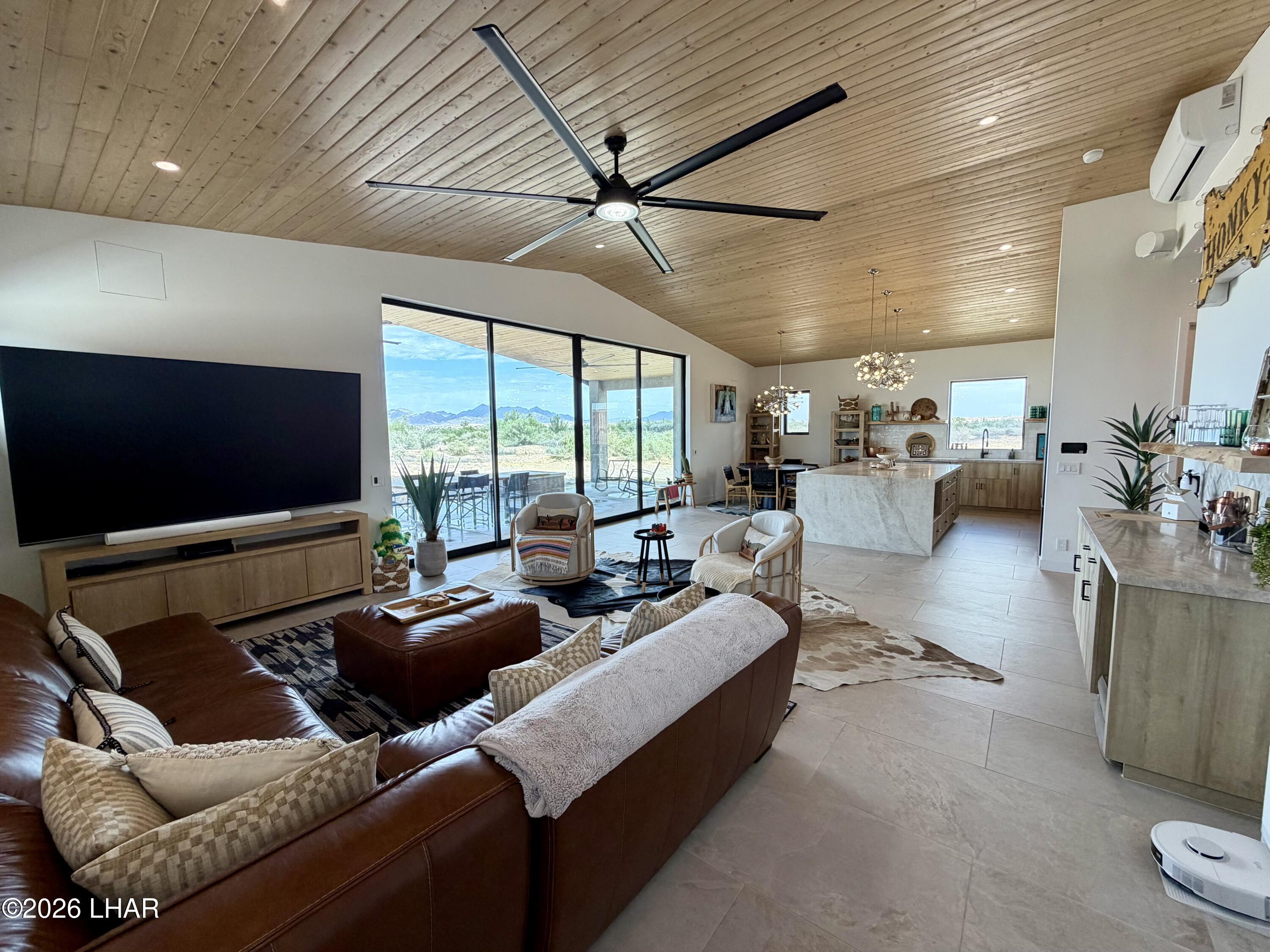 48963 Riviera Place Ehrenberg, AZ 85334 - Photo 12 of 58 a living room with furniture and a flat screen tv