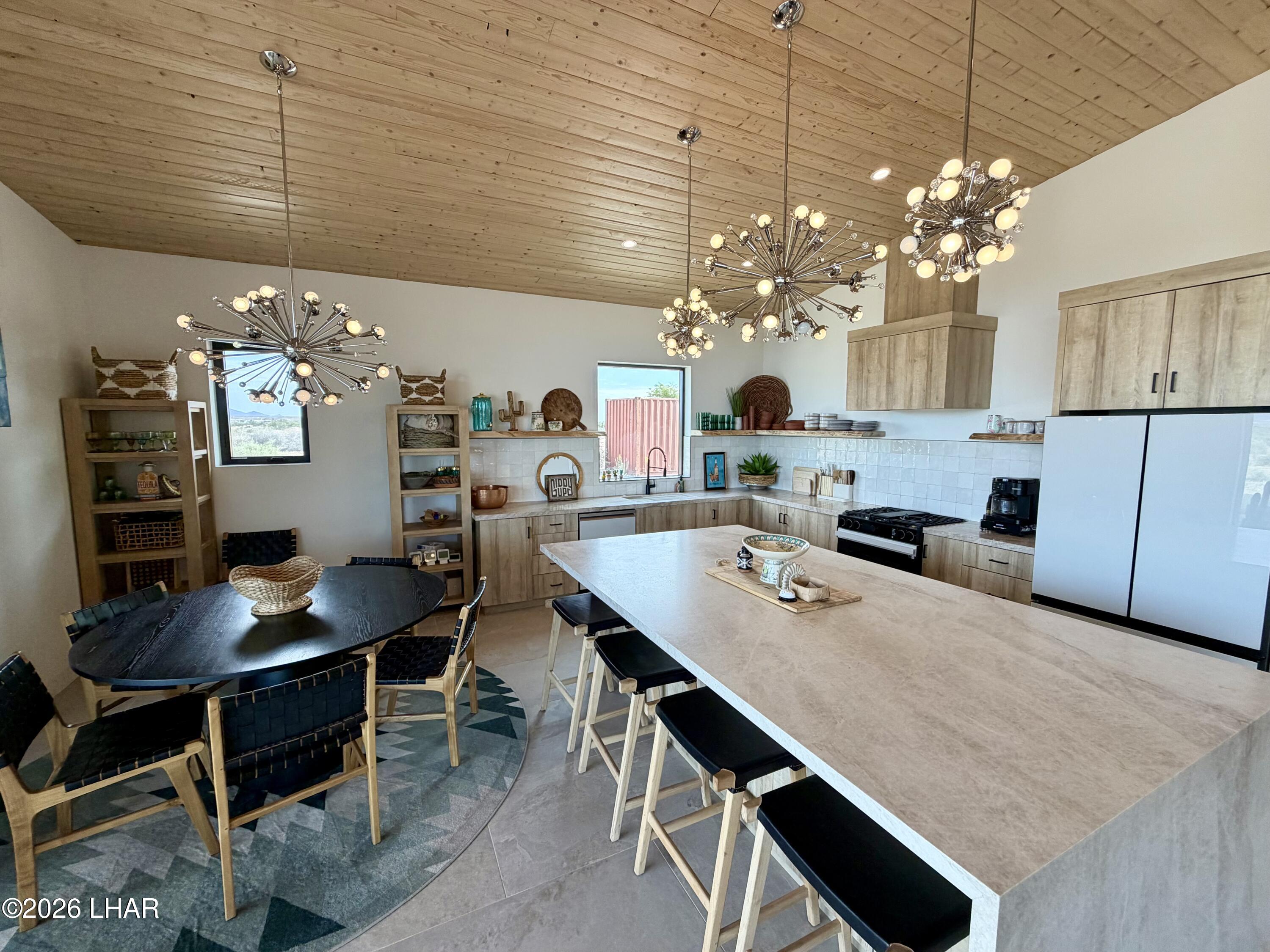 48963 Riviera Place Ehrenberg, AZ 85334 - Photo 18 of 58 a kitchen with a table and chairs in it