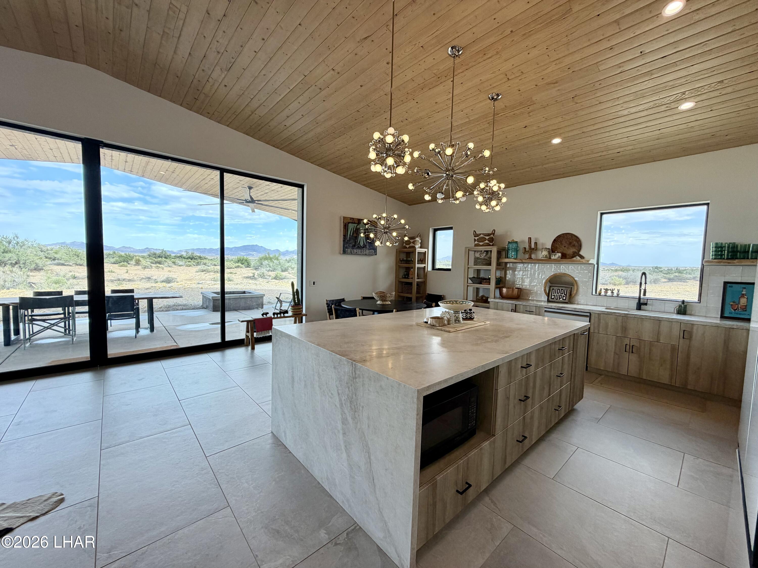 48963 Riviera Place Ehrenberg, AZ 85334 - Photo 19 of 58 a large white kitchen with a large window