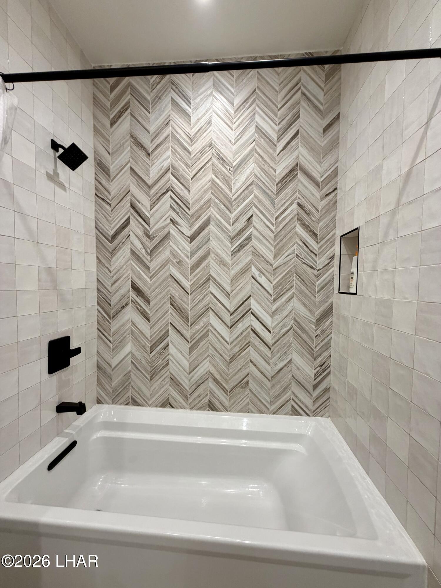 48963 Riviera Place Ehrenberg, AZ 85334 - Photo 27 of 58 a bathroom with a bathtub and a shower