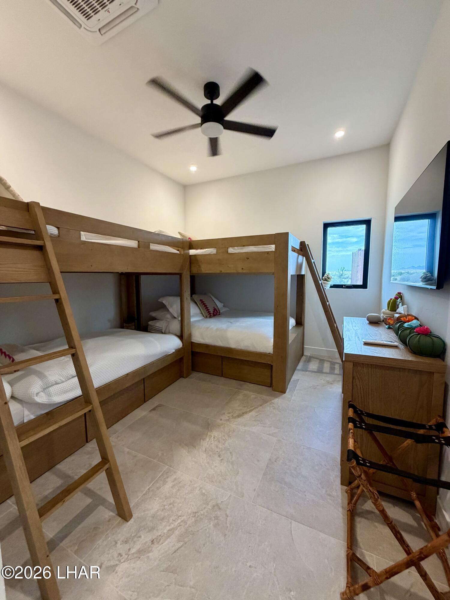 48963 Riviera Place Ehrenberg, AZ 85334 - Photo 29 of 58 a bedroom with furniture and a ceiling fan