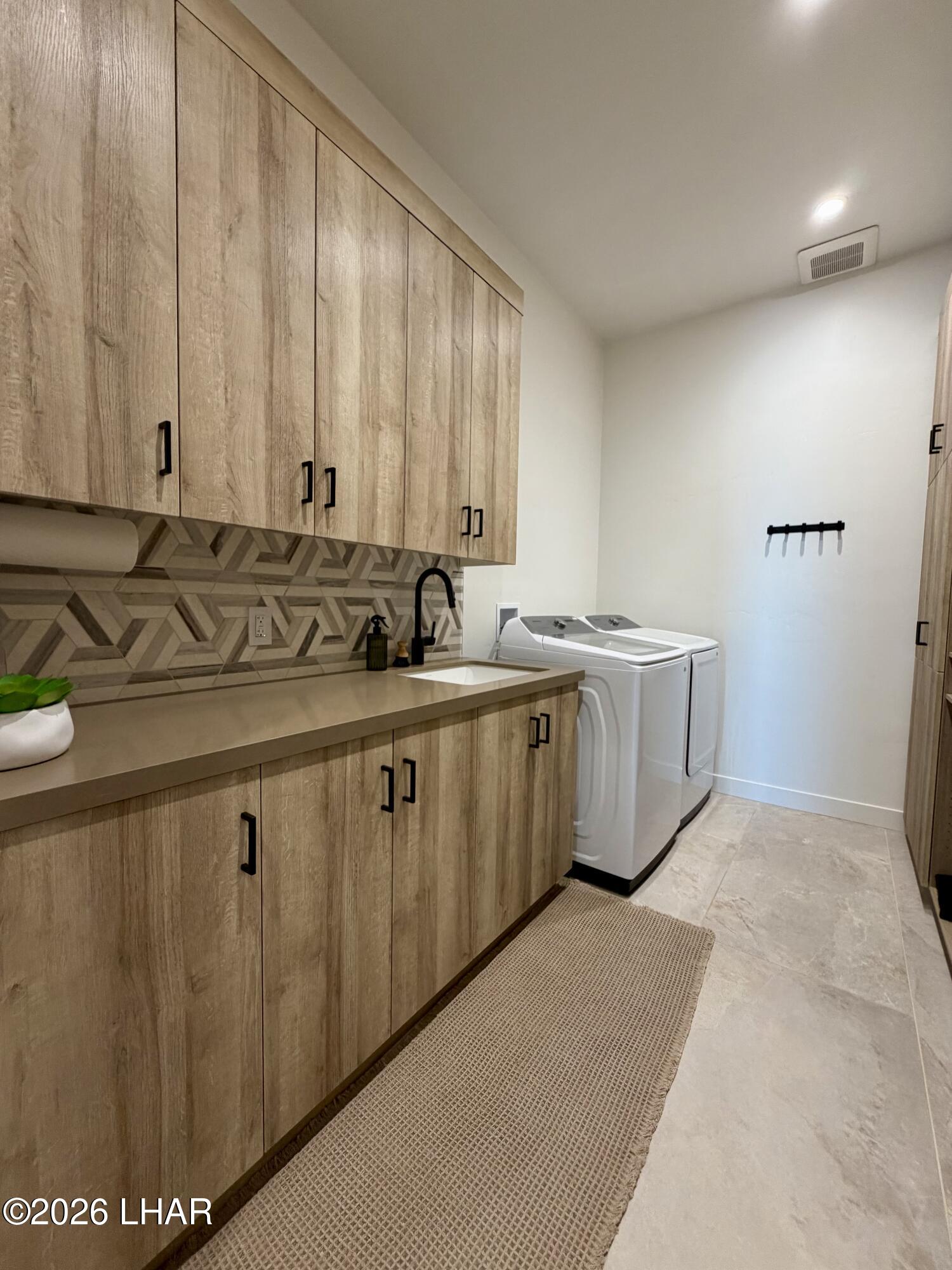 48963 Riviera Place Ehrenberg, AZ 85334 - Photo 45 of 58 a bathroom with a sink and a mirror