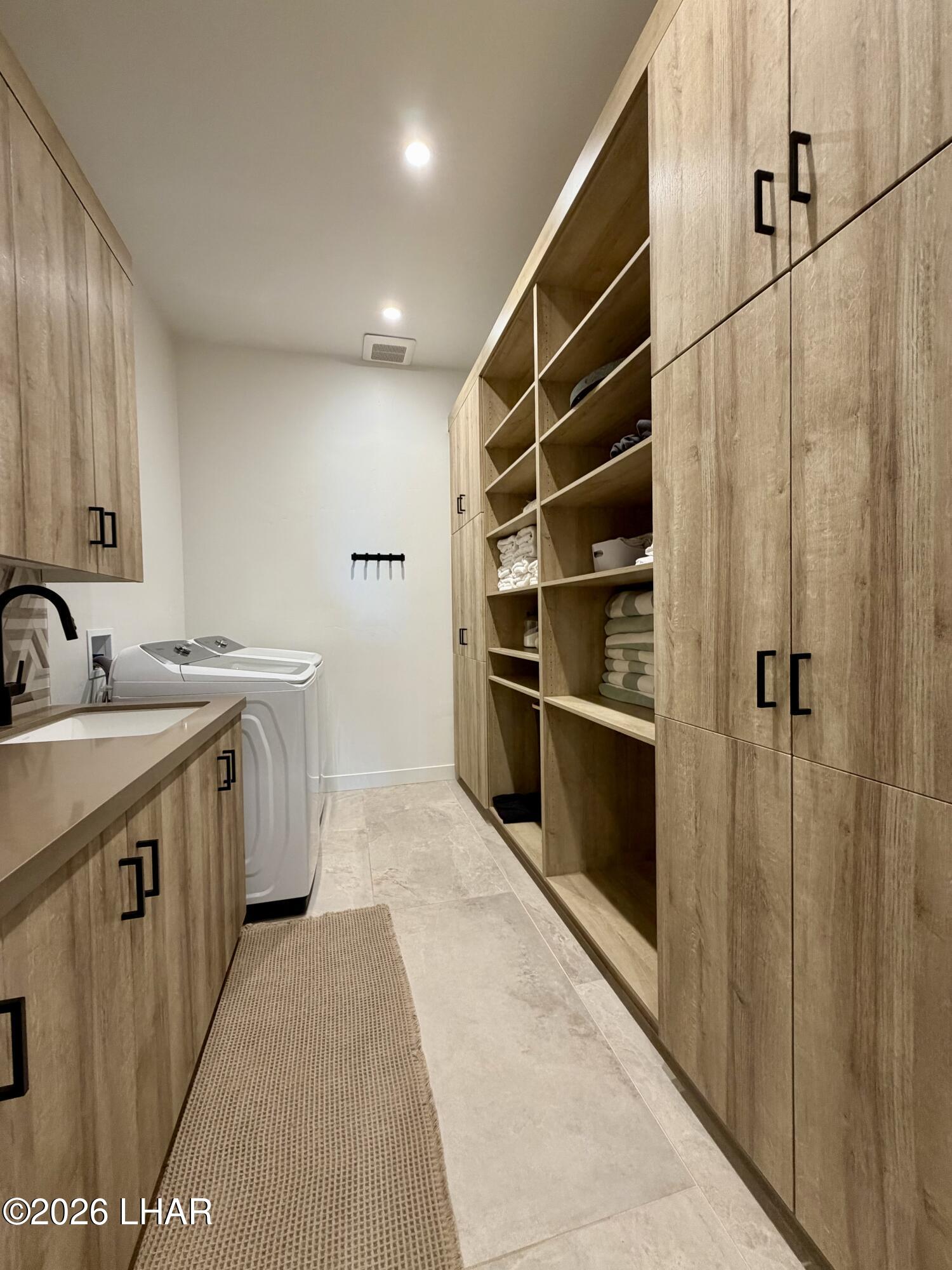 48963 Riviera Place Ehrenberg, AZ 85334 - Photo 46 of 58 a kitchen with a sink and a refrigerator