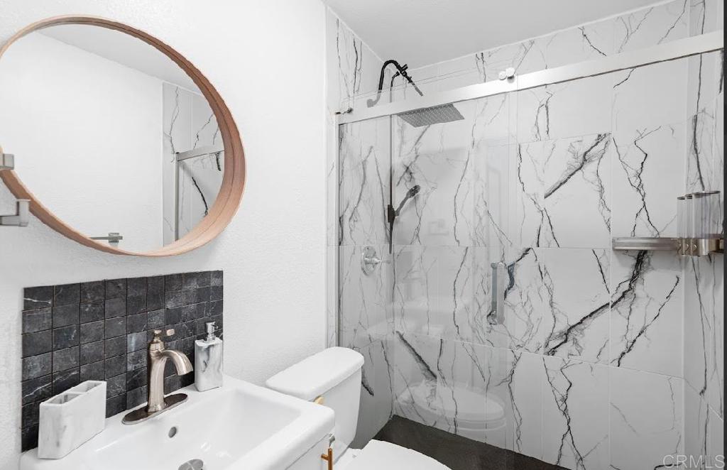 3964 Delta Street San Diego, CA 92113 - Photo 34 of 42 a bathroom with a sink and a mirror
