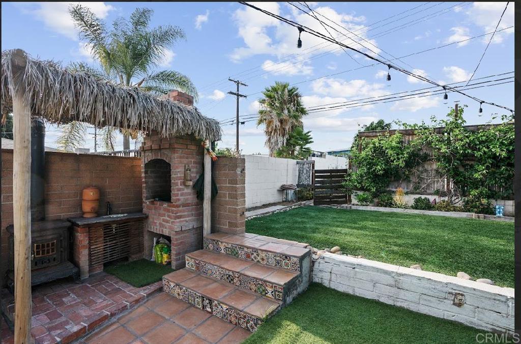 3964 Delta Street San Diego, CA 92113 - Photo 39 of 42 a view of backyard with outdoor seating and green space