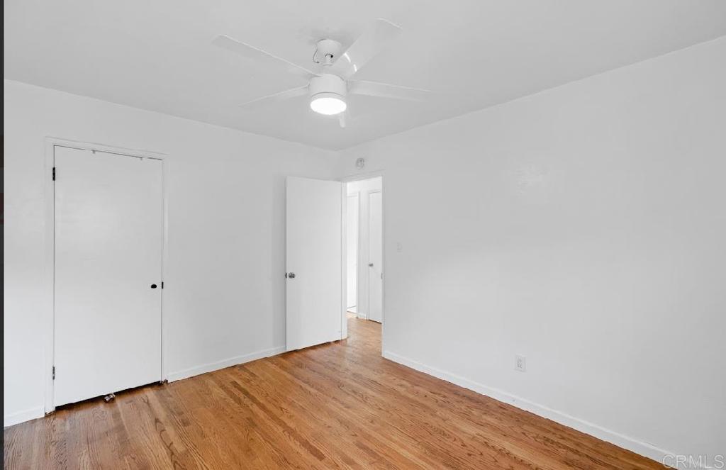 3964 Delta Street San Diego, CA 92113 - Photo 9 of 42 a view of an empty room with wooden floor