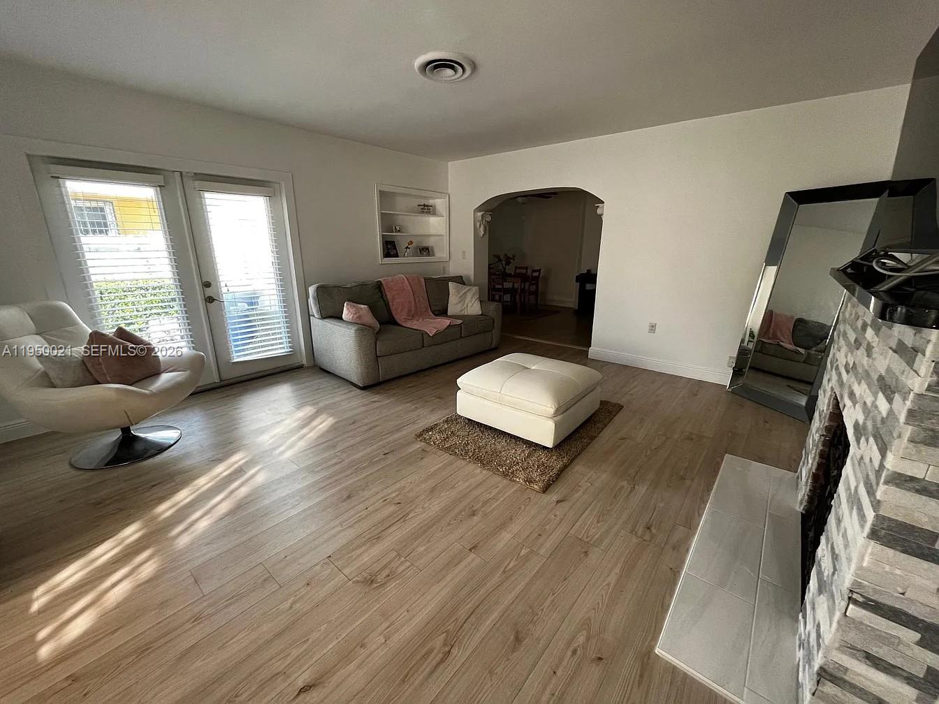 2049 Southwest 60th Court, Unit 1 Miami, FL 33155 - Photo 3 of 16 a living room with furniture and a window