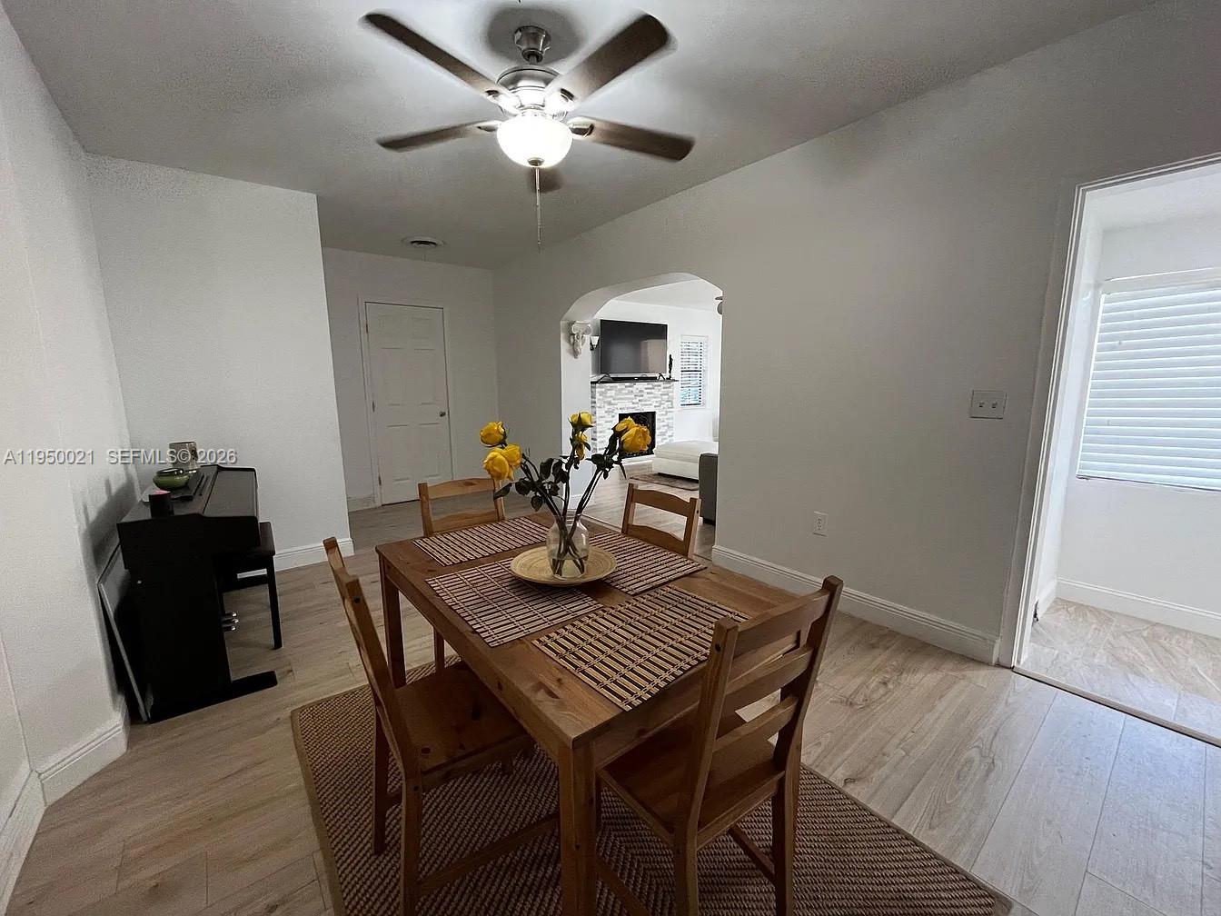 2049 Southwest 60th Court, Unit 1 Miami, FL 33155 - Photo 8 of 16 a view of a dining room with furniture and wooden floor
