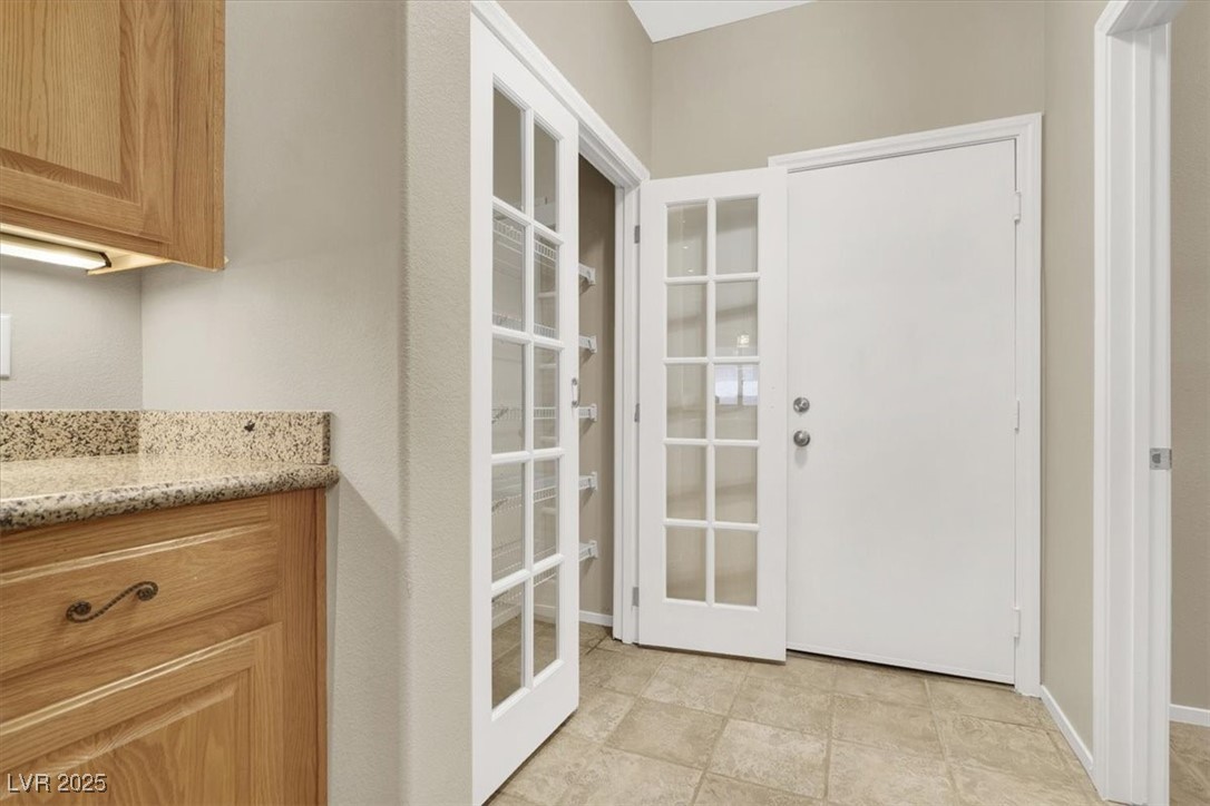 636 Pacific Cascades Drive Henderson, NV 89012 - Photo 20 of 51 Doorway to outside with baseboards