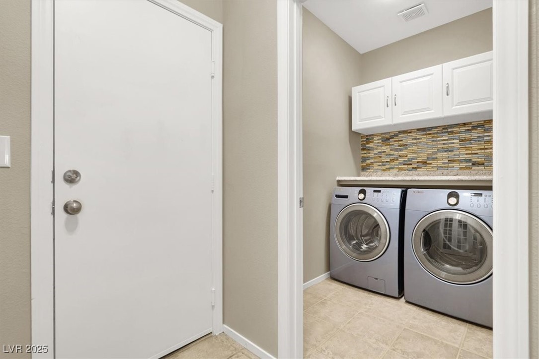 636 Pacific Cascades Drive Henderson, NV 89012 - Photo 21 of 51 Washroom featuring washing machine and dryer and cabinet space