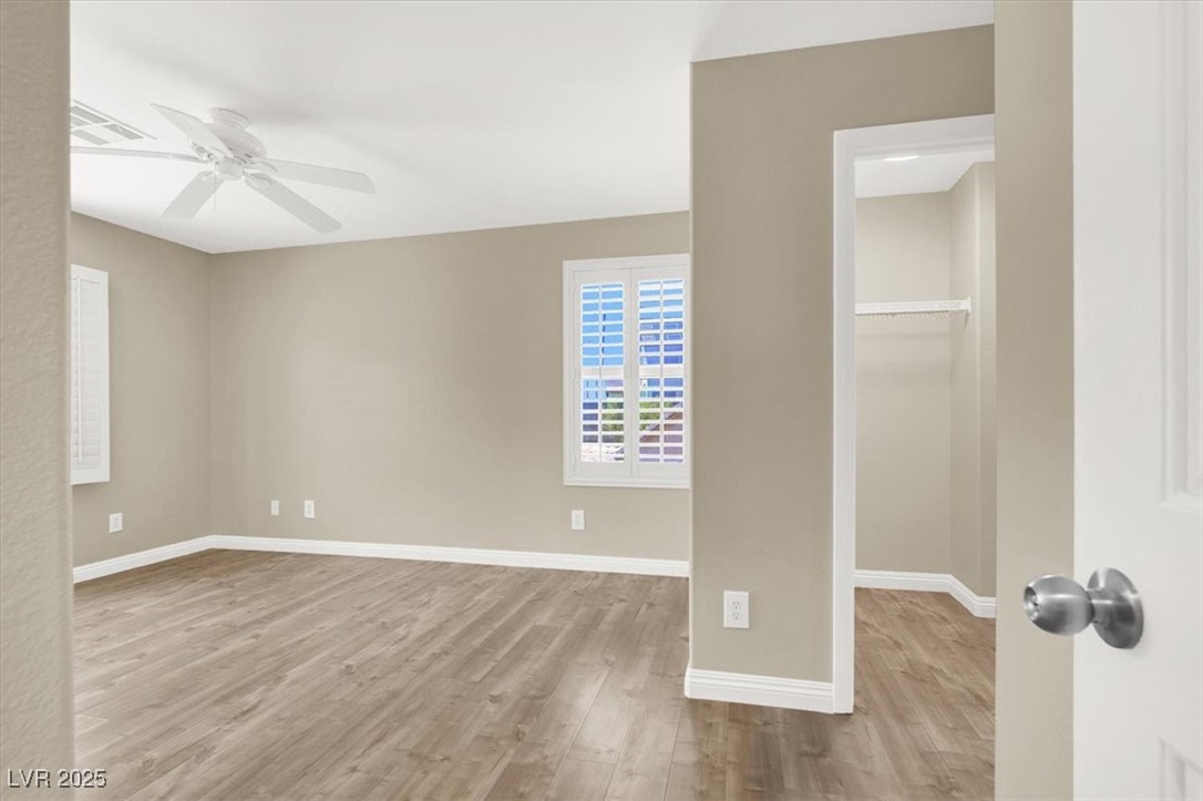636 Pacific Cascades Drive Henderson, NV 89012 - Photo 27 of 51 Spare room with light wood-style flooring and ceiling fan